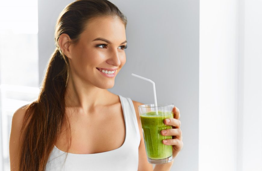 Diet. Healthy Eating Woman Drinking Fresh Raw Green Detox Vegetable Juice. Healthy Lifestyle, Vegetarian Food And Meal. Drink Smoothie. Nutrition Concept.