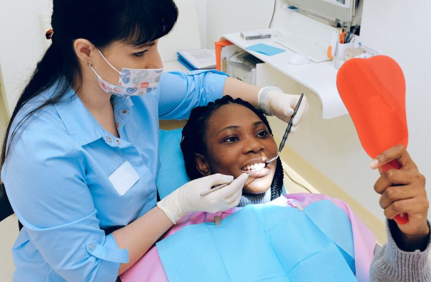 dentist with a happy woman patient