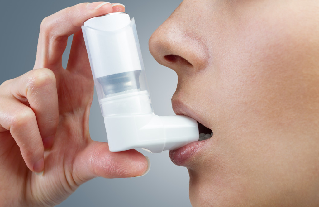 A man using inhaler for asthma