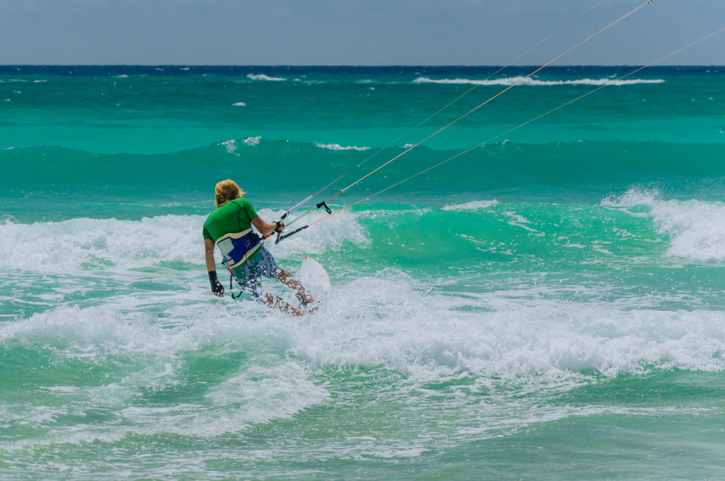 man kite surfing in ocean