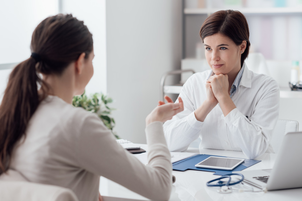 woman consulting to a doctor