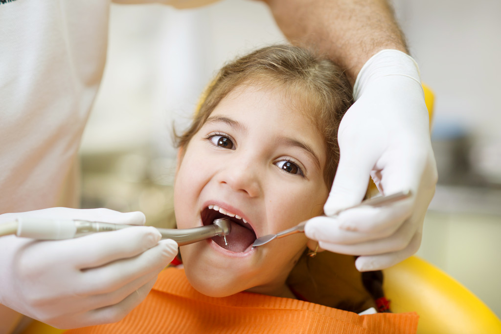 child at dentist checkup