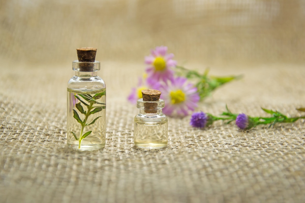 small glass bottles filled with essential oil