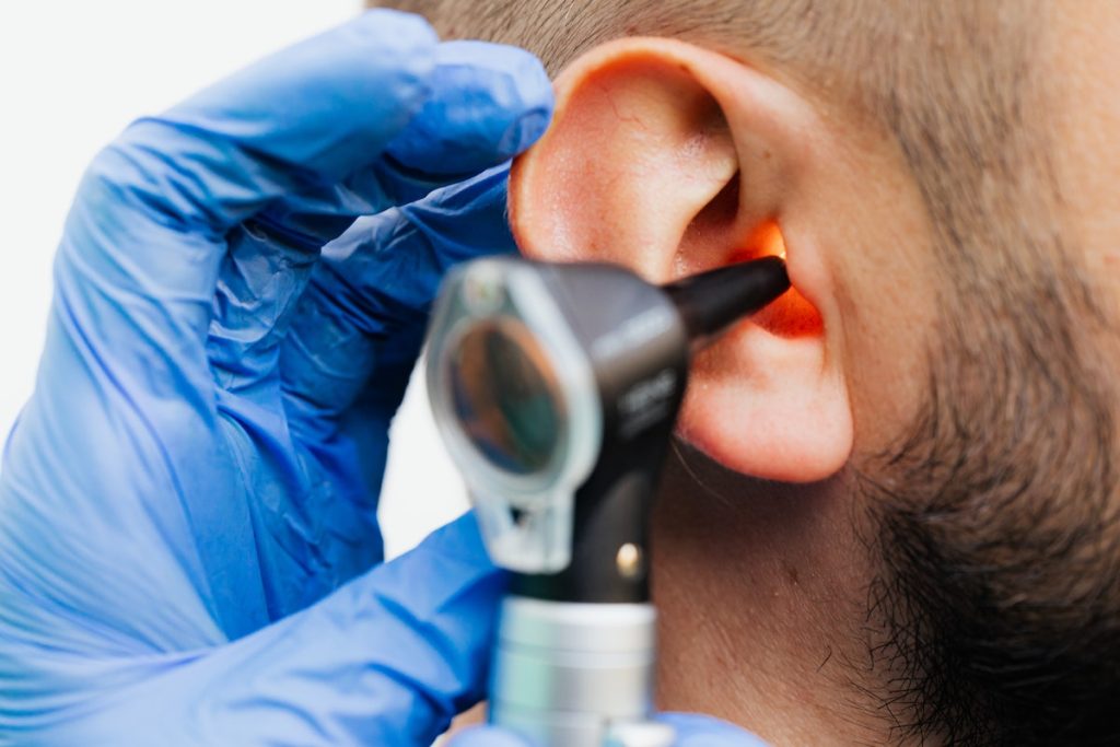 doctor checking a patient's ear
